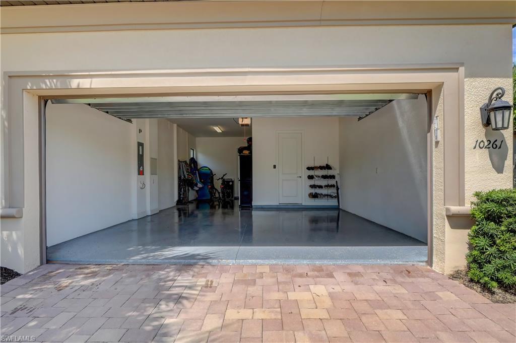 10261 Coconut Road Estero, FL 34135 - Photo 31 of 31 Oversized 2 car garage with extra storage.