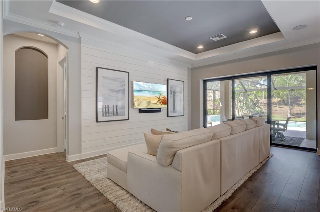 10261 Coconut Road Estero, FL 34135 - Photo 10 of 31 Family room opening to outdoor living.