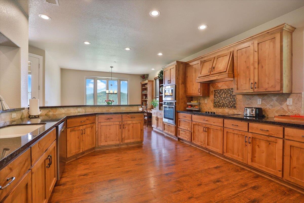 1111 Scott Road Lotus, CA 95651 - Photo 20 of 77 Large gourmet kitchen with custom knotty alder cabinets.