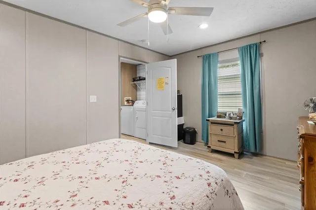 a bedroom with a bed and a dresser