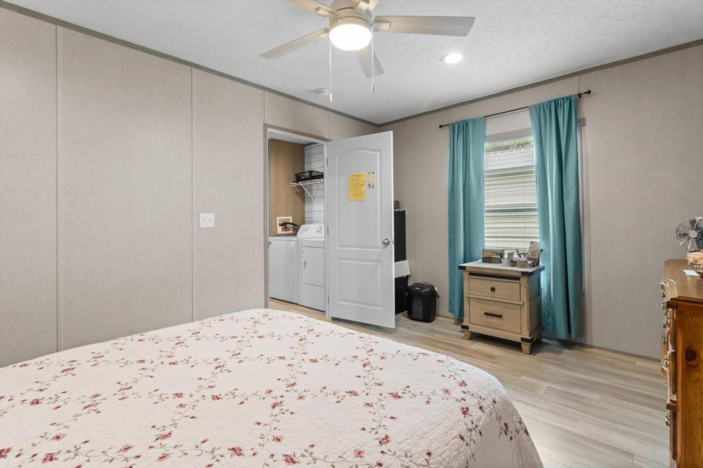 4686 C R 656 Webster, FL 33597 - Photo 19 of 32 a bedroom with a bed and a dresser