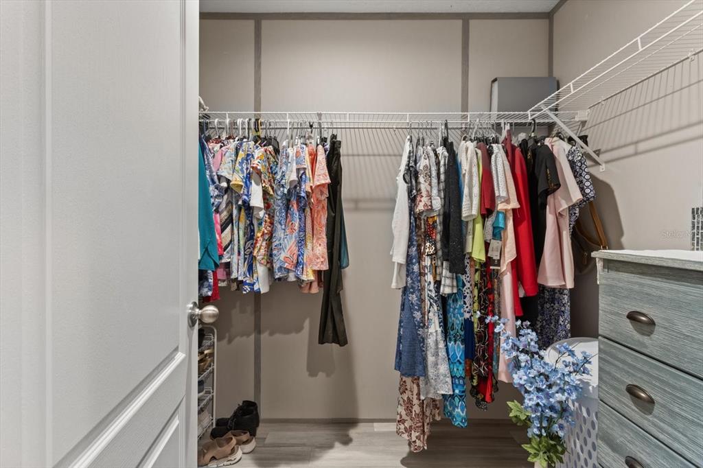 4686 C R 656 Webster, FL 33597 - Photo 22 of 32 a view of walk in closet with clothes
