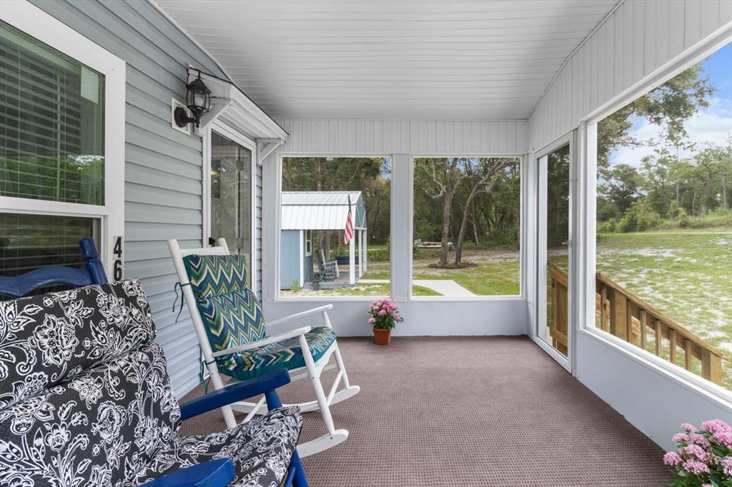 4686 C R 656 Webster, FL 33597 - Photo 23 of 32 a living room with furniture and a large window