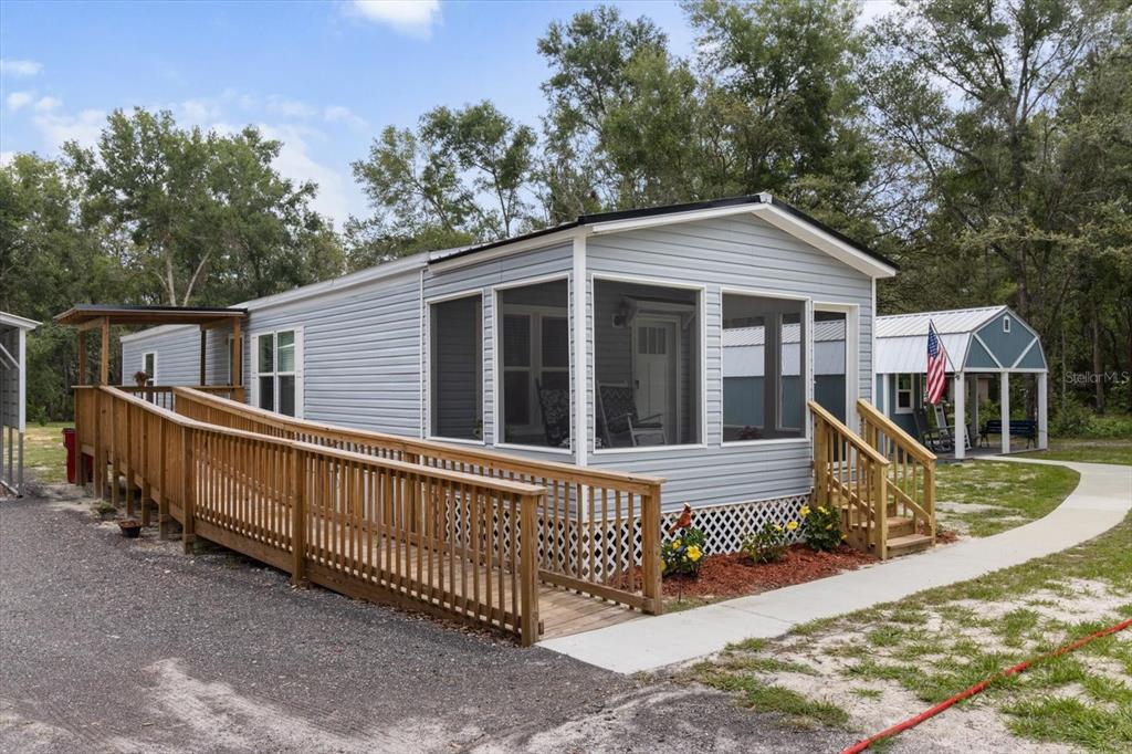 4686 C R 656 Webster, FL 33597 - Photo 4 of 32 a view of a house with wooden fence