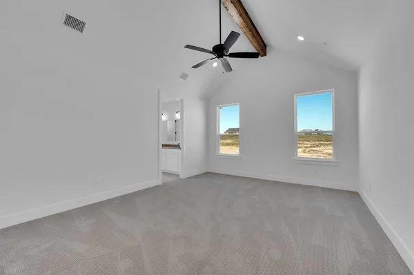 a view of room with window and ceiling fan