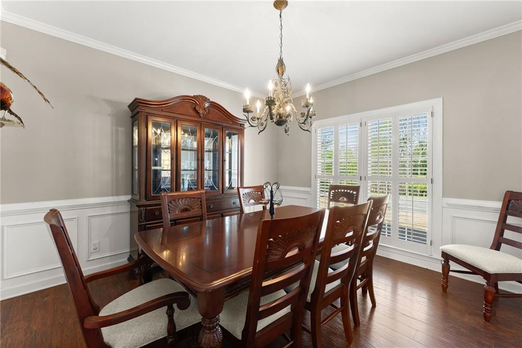 4834 Upper Berkshire Road Flowery Branch, GA 30542 - Photo 13 of 76 a view of a dining room with furniture window and wooden floor