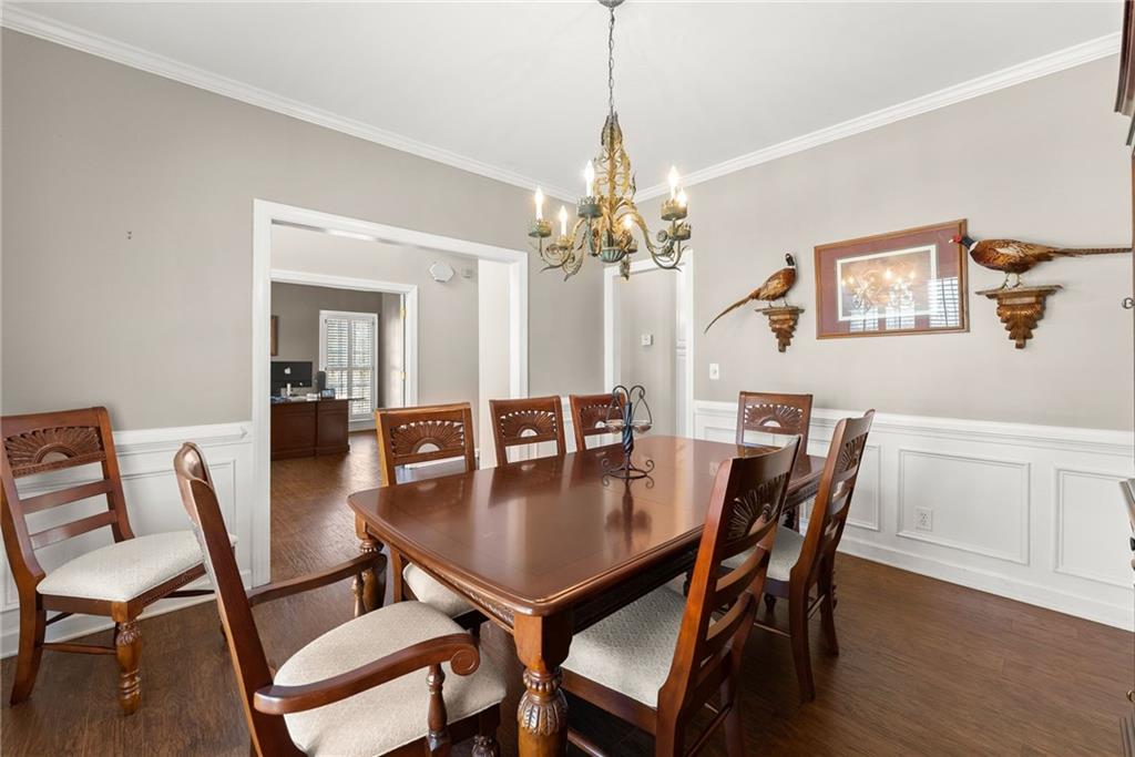 4834 Upper Berkshire Road Flowery Branch, GA 30542 - Photo 14 of 76 a dining room with furniture and wooden floor