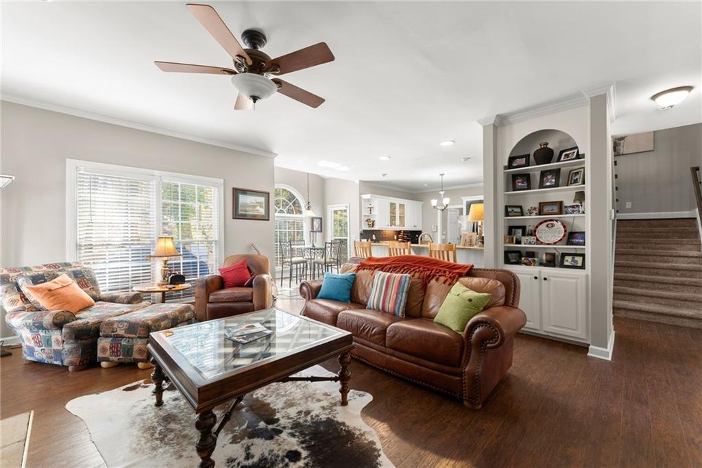 4834 Upper Berkshire Road Flowery Branch, GA 30542 - Photo 17 of 76 a living room with furniture a rug and a window