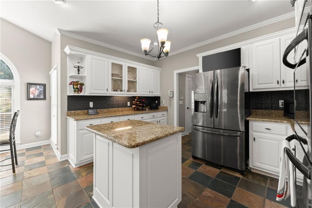 4834 Upper Berkshire Road Flowery Branch, GA 30542 - Photo 20 of 76 a kitchen with stainless steel appliances granite countertop a refrigerator a stove a sink and a refrigerator
