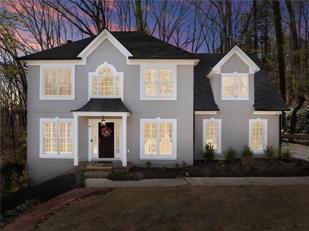 4834 Upper Berkshire Road Flowery Branch, GA 30542 - Photo 2 of 76 a front view of a house with a yard