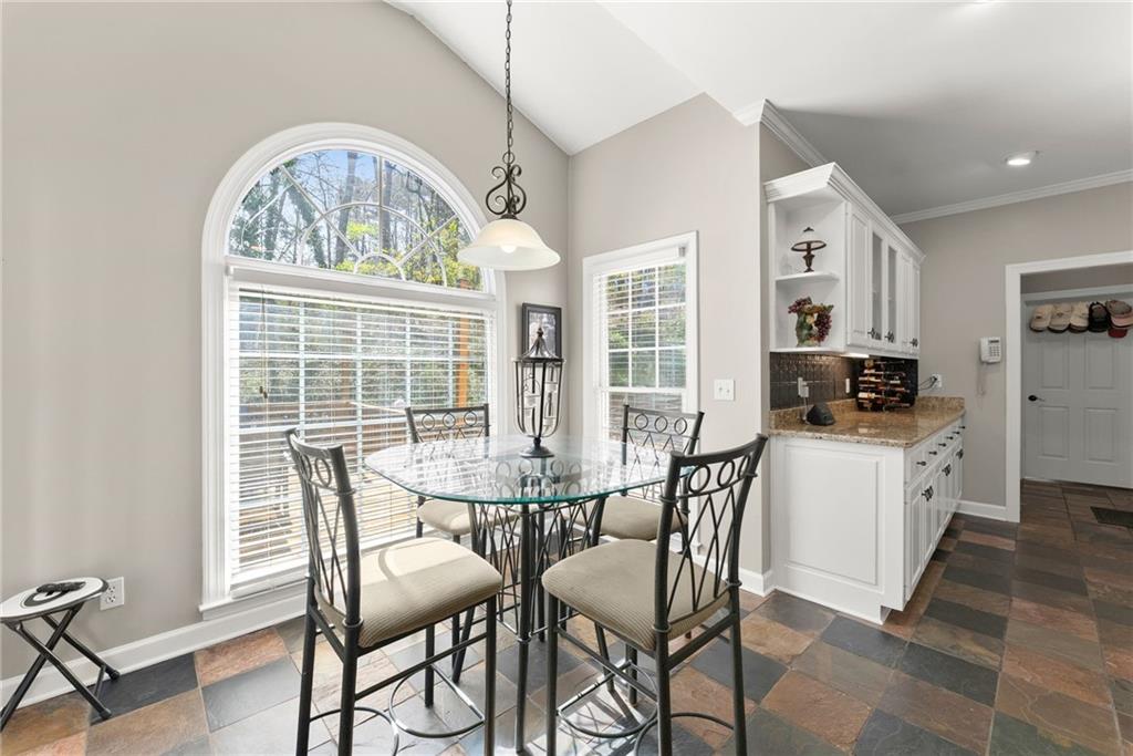 4834 Upper Berkshire Road Flowery Branch, GA 30542 - Photo 23 of 76 a view of a dining room with furniture window and outside view