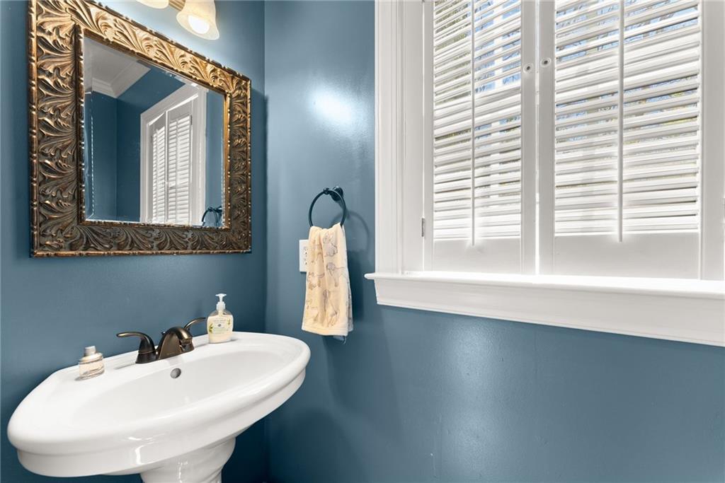 4834 Upper Berkshire Road Flowery Branch, GA 30542 - Photo 24 of 76 a bathroom with a sink and a mirror