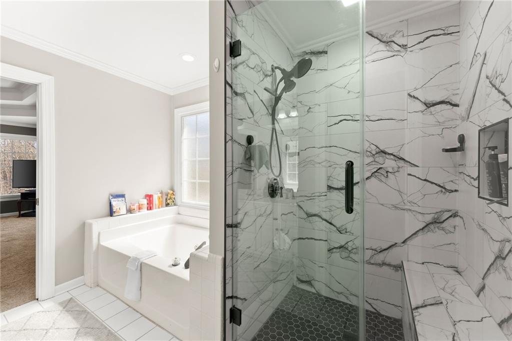 4834 Upper Berkshire Road Flowery Branch, GA 30542 - Photo 33 of 76 a bathroom with a sink vanity and shower