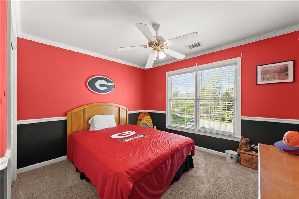 4834 Upper Berkshire Road Flowery Branch, GA 30542 - Photo 37 of 76 a bed room with a bed and a window