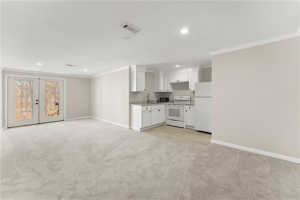 4834 Upper Berkshire Road Flowery Branch, GA 30542 - Photo 43 of 76 a view of a kitchen with a sink and cabinets