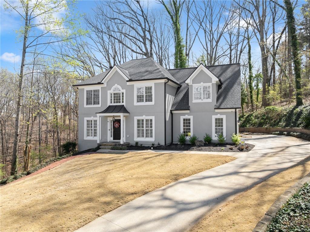4834 Upper Berkshire Road Flowery Branch, GA 30542 - Photo 5 of 76 a front view of a house with a yard