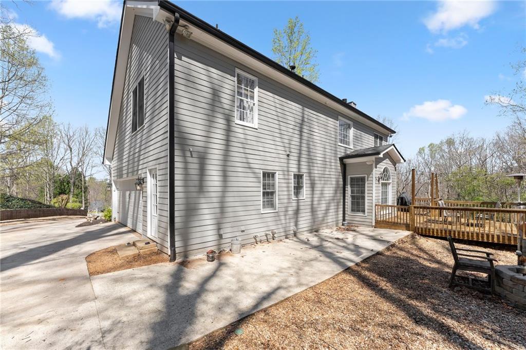 4834 Upper Berkshire Road Flowery Branch, GA 30542 - Photo 53 of 76 a view of a house with backyard and sitting area