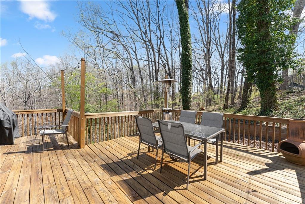 4834 Upper Berkshire Road Flowery Branch, GA 30542 - Photo 56 of 76 a view of a chairs on wooden deck