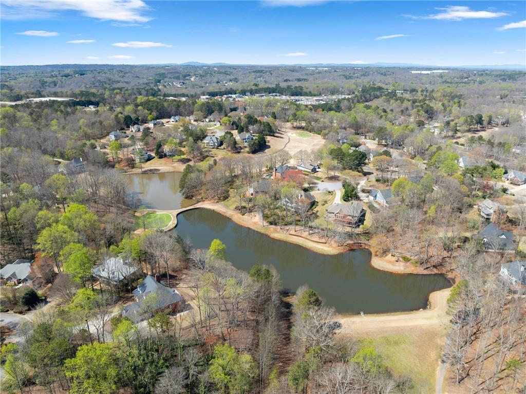 4834 Upper Berkshire Road Flowery Branch, GA 30542 - Photo 69 of 76 an aerial view of a house with a lake view