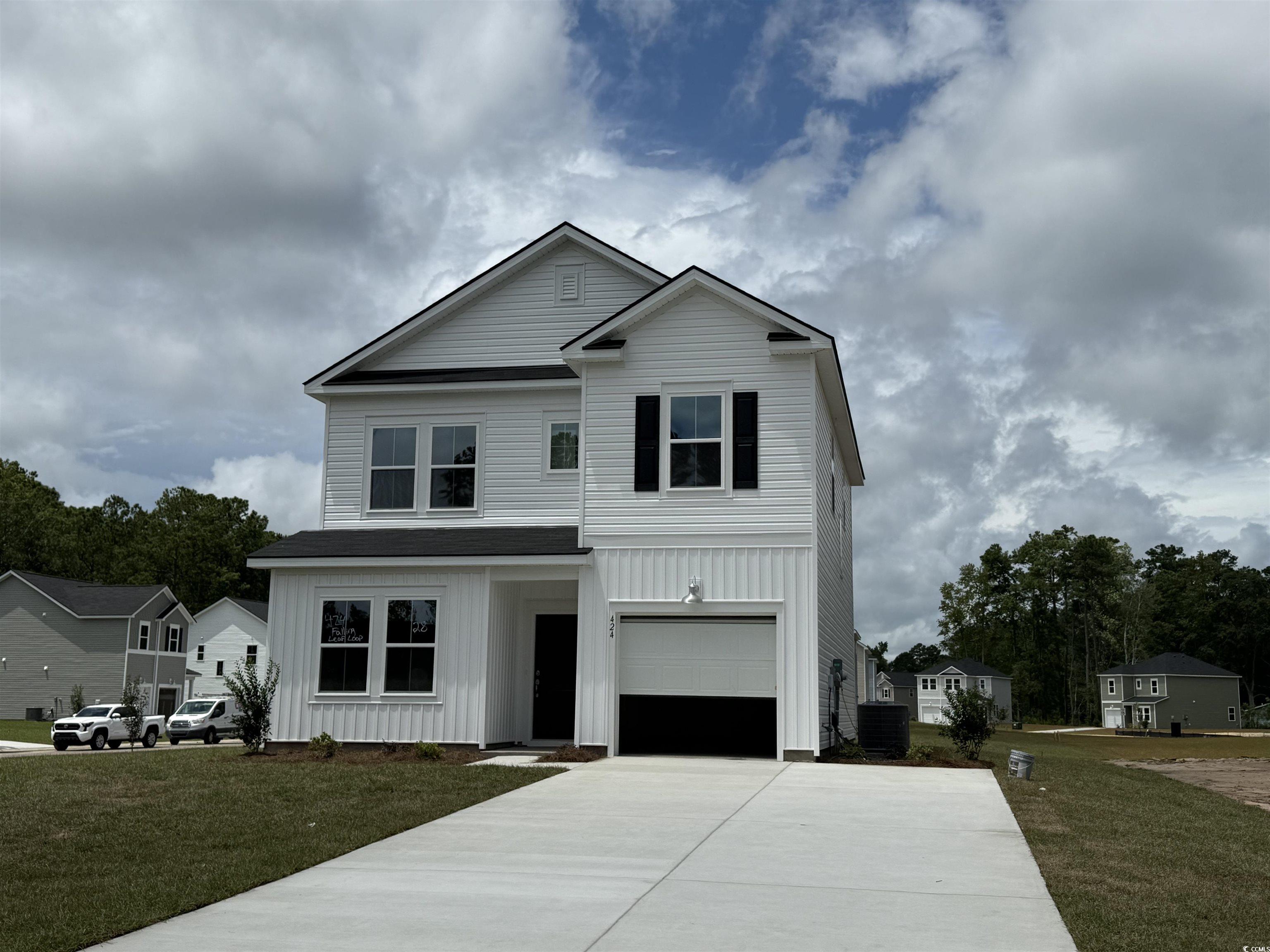 424 Falling Leaf Loop Myrtle Beach, SC 29588 - Photo 1 of 1 View of front of home with driveway, a front lawn,