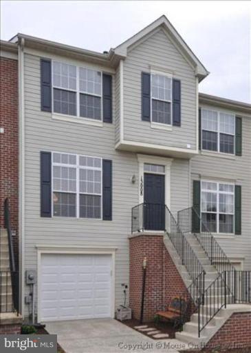 a view of front a house with large windows