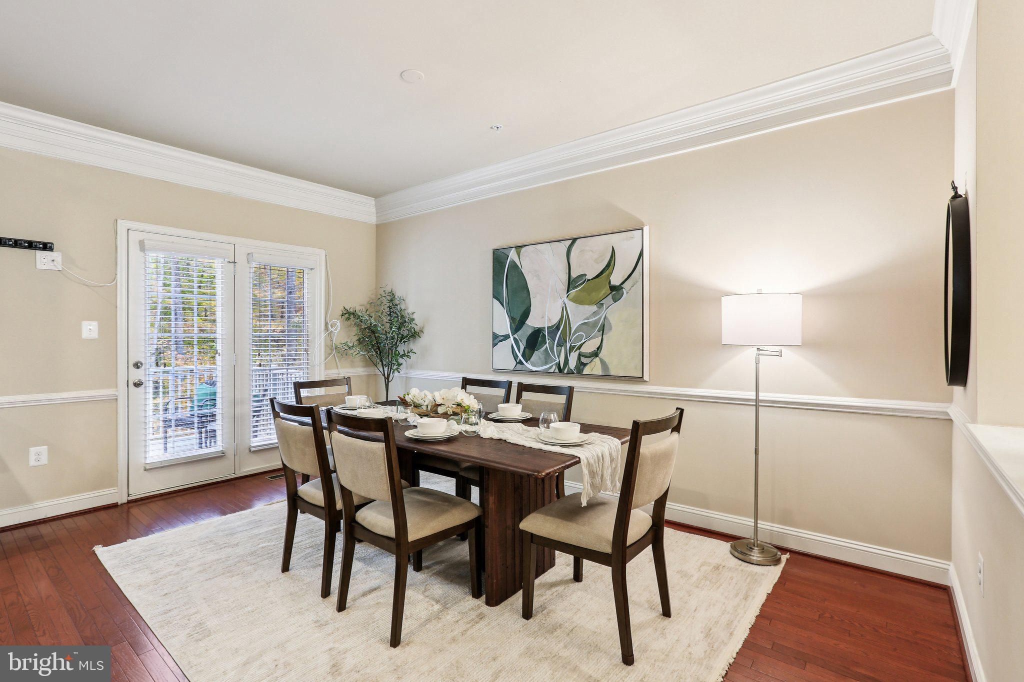 9384 Rock Ripple Lane Laurel, MD 20723 - Photo 13 of 42 a view of a dining room with furniture and wooden floor