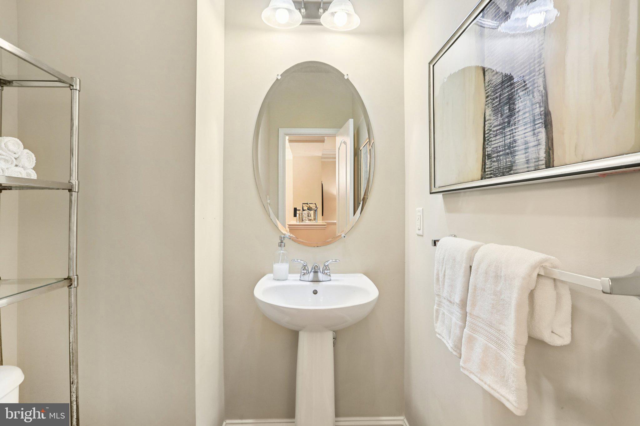 9384 Rock Ripple Lane Laurel, MD 20723 - Photo 14 of 42 a bathroom with a sink and a mirror