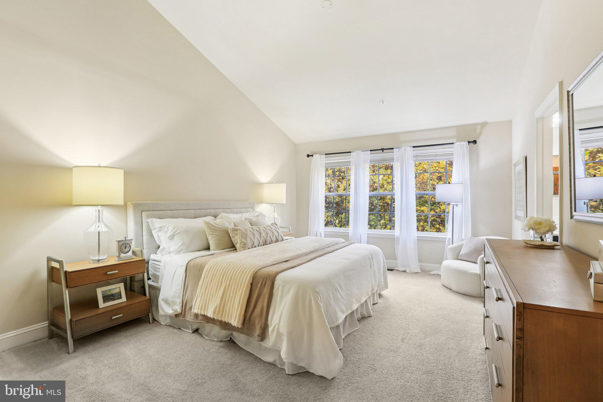 9384 Rock Ripple Lane Laurel, MD 20723 - Photo 17 of 42 a bedroom with a bed couch and a large window