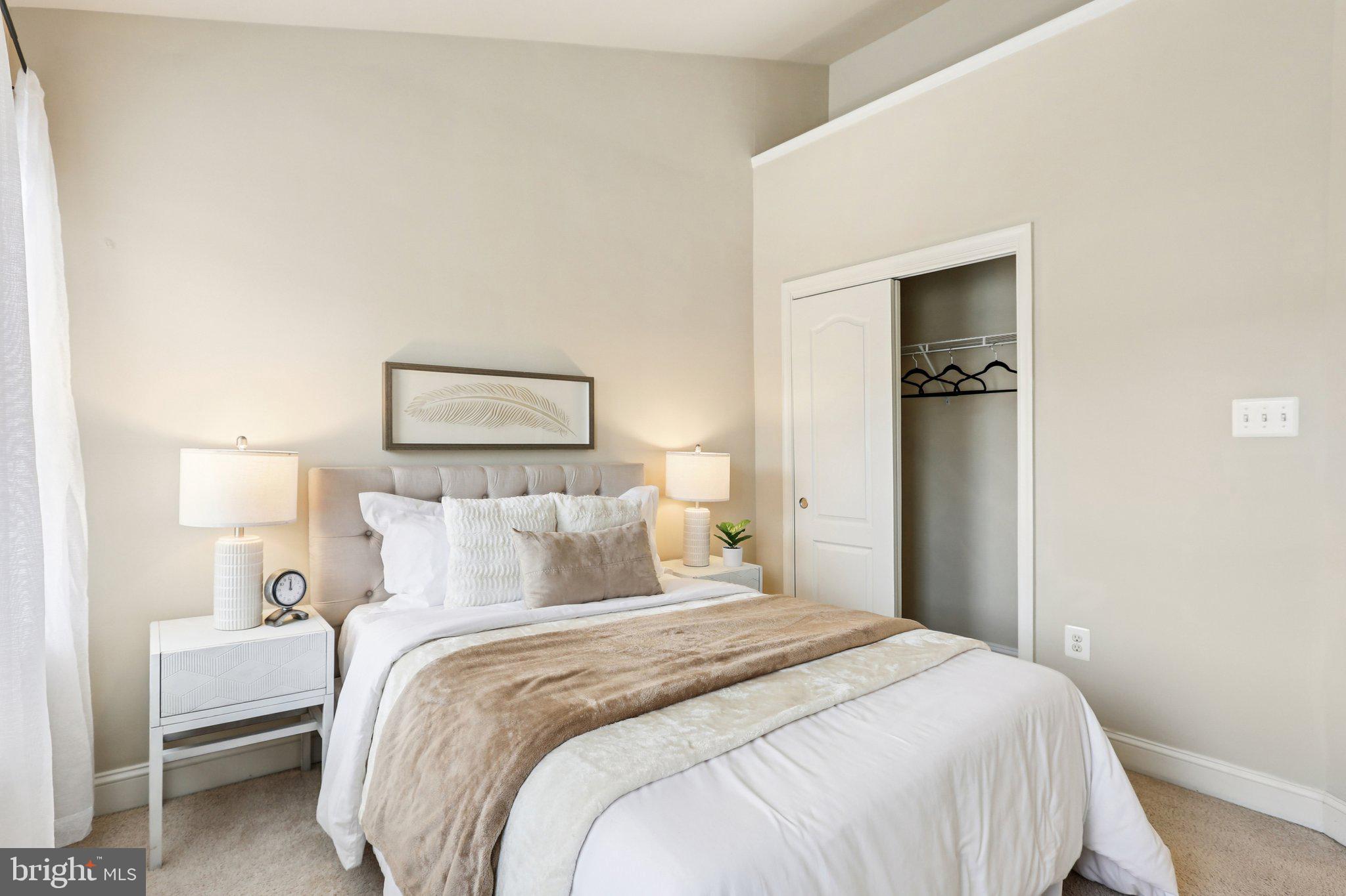 9384 Rock Ripple Lane Laurel, MD 20723 - Photo 26 of 42 a bedroom with a bed and a night stand