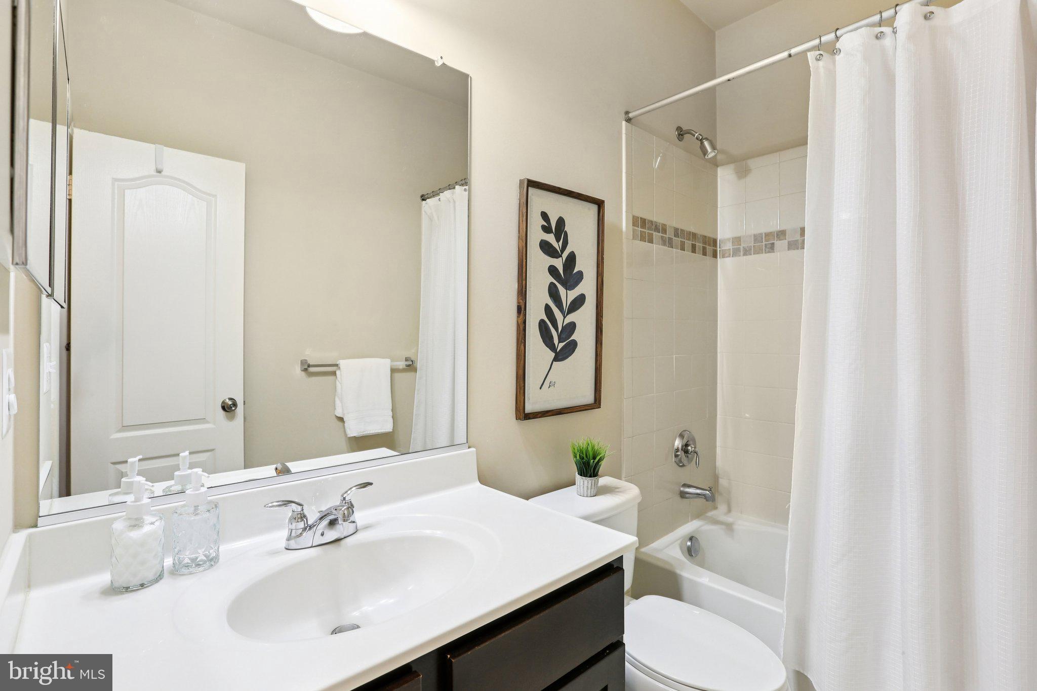 9384 Rock Ripple Lane Laurel, MD 20723 - Photo 27 of 42 a bathroom with a sink toilet and shower