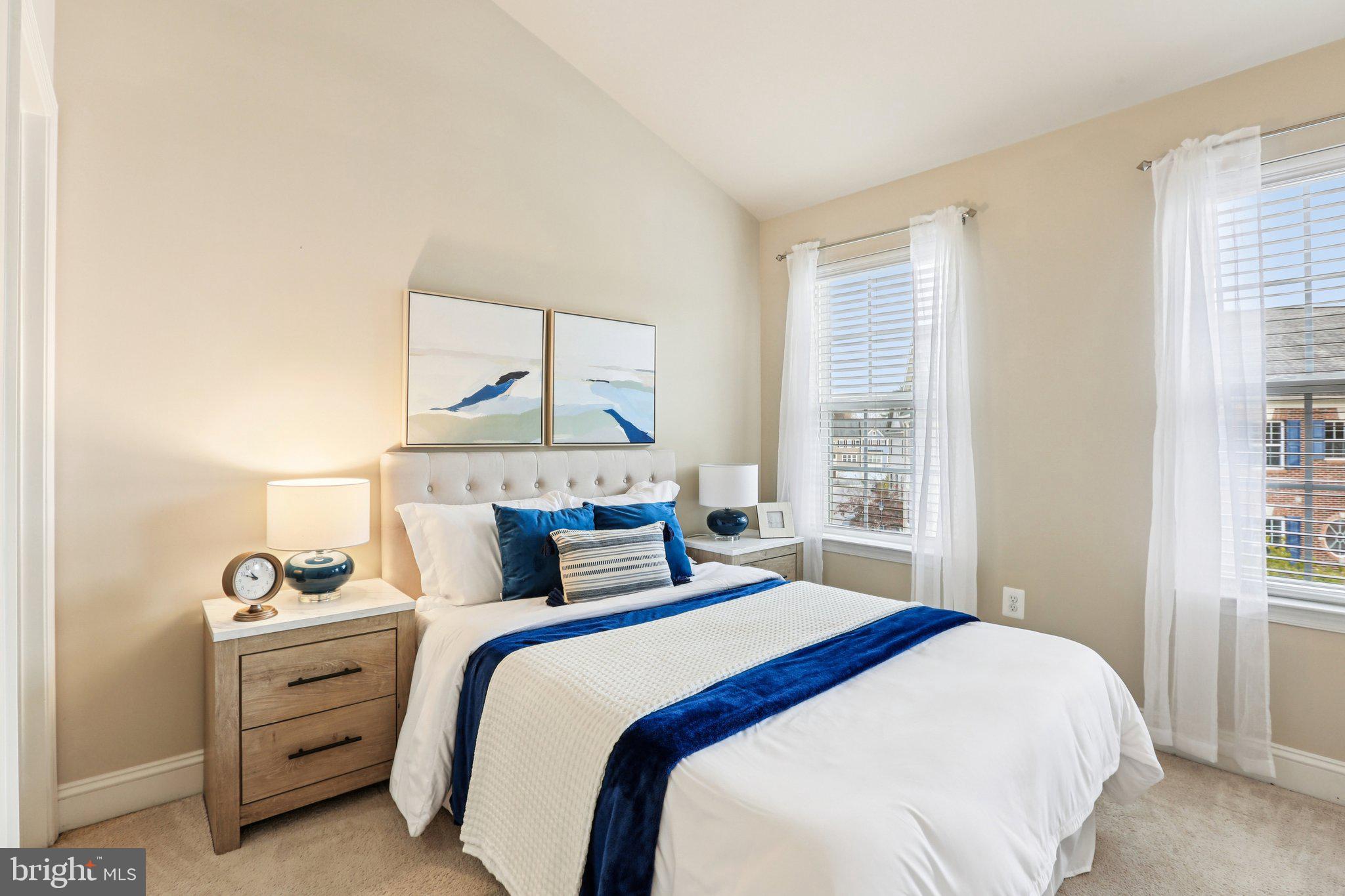 9384 Rock Ripple Lane Laurel, MD 20723 - Photo 28 of 42 a bedroom with a bed a window and mirror