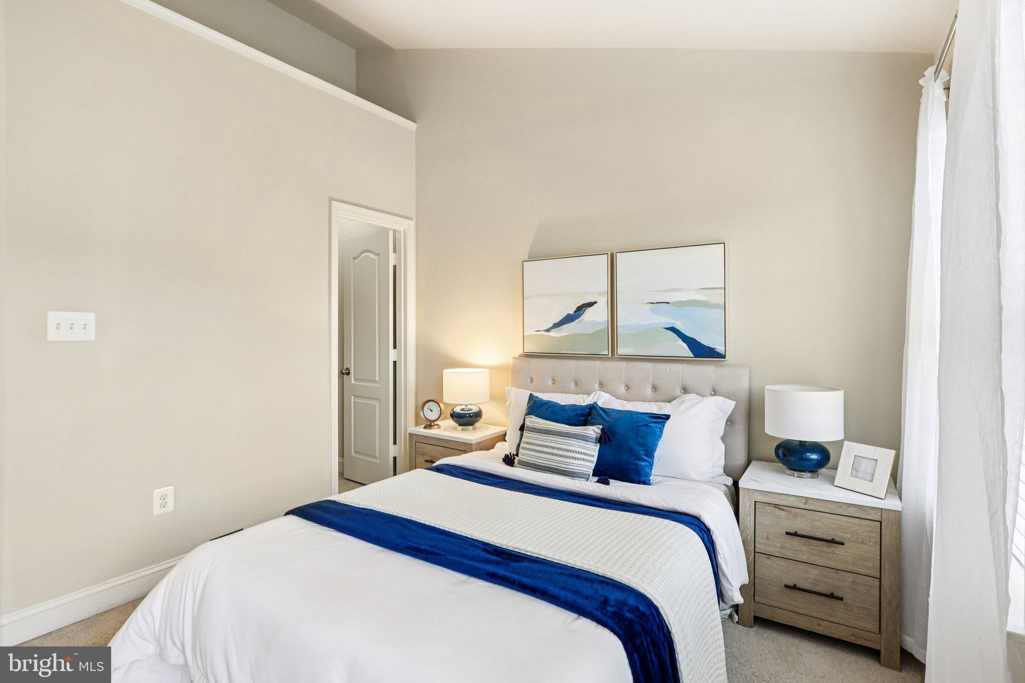 9384 Rock Ripple Lane Laurel, MD 20723 - Photo 29 of 42 a bedroom with a bed and a painting on the wall