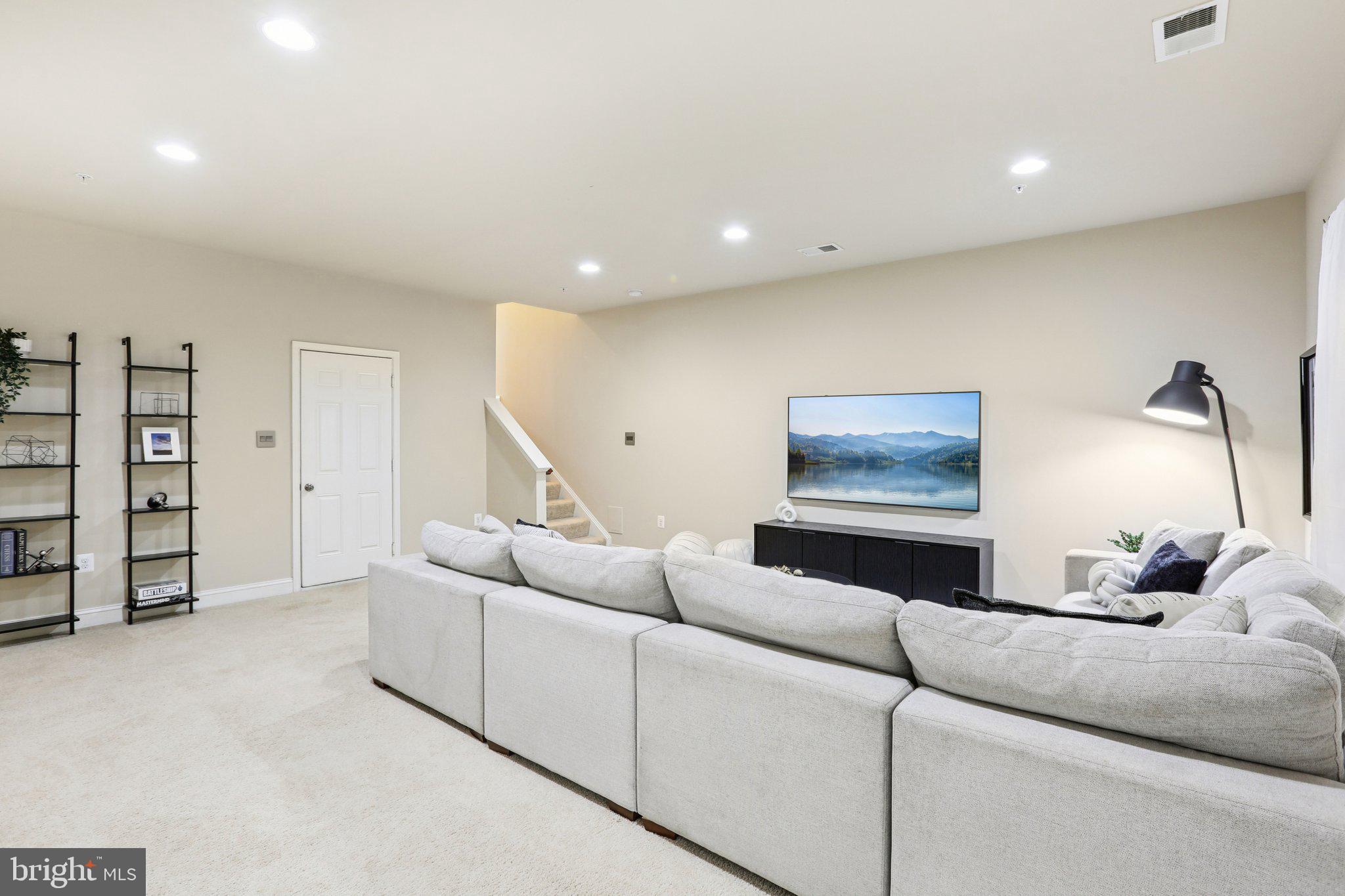 9384 Rock Ripple Lane Laurel, MD 20723 - Photo 32 of 42 a living room with furniture and a ceiling fan