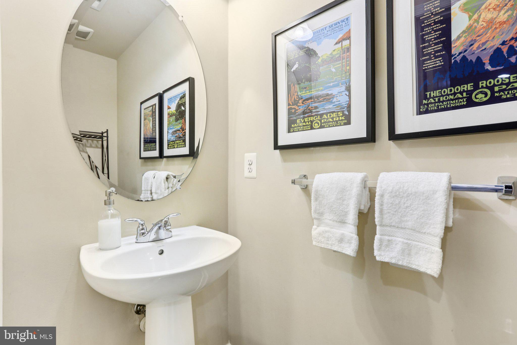 9384 Rock Ripple Lane Laurel, MD 20723 - Photo 33 of 42 a bathroom with a sink and a mirror