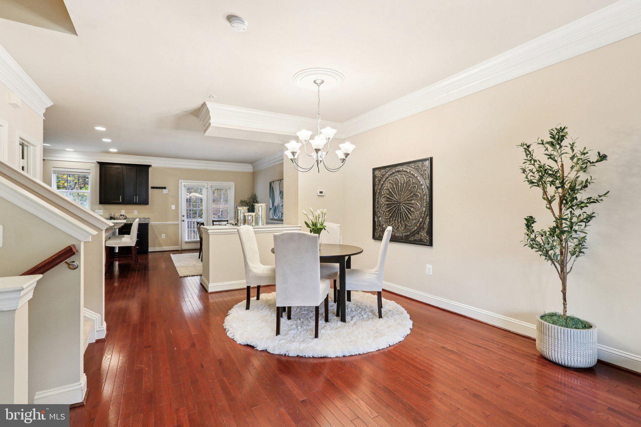 9384 Rock Ripple Lane Laurel, MD 20723 - Photo 6 of 42 a living room with furniture a chandelier and a dining room