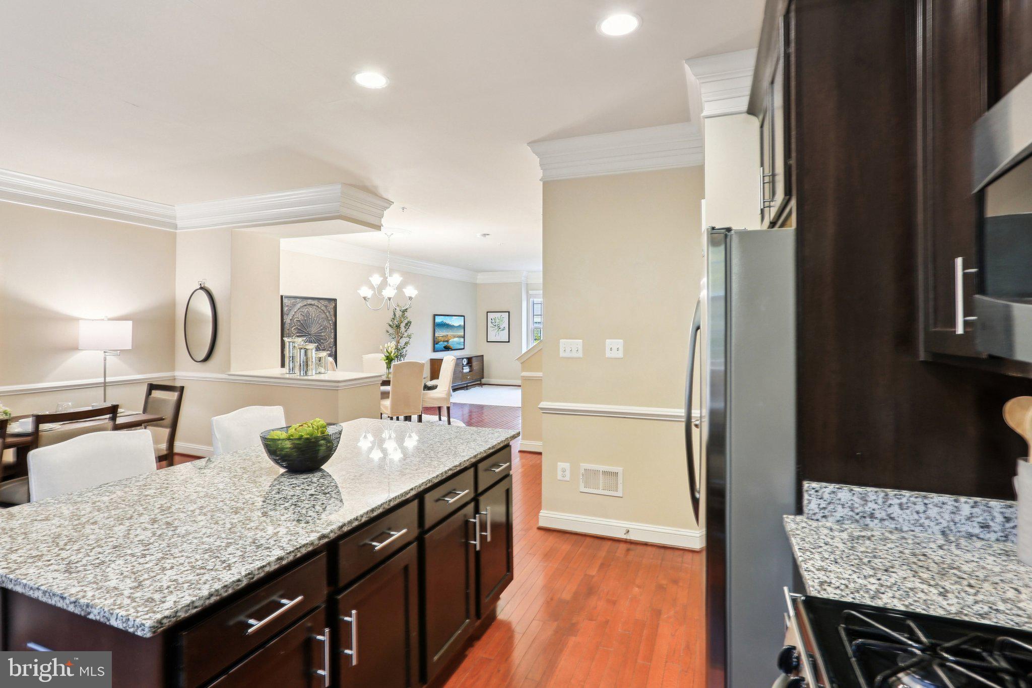 9384 Rock Ripple Lane Laurel, MD 20723 - Photo 8 of 42 a kitchen with granite countertop a counter space and stainless steel appliances