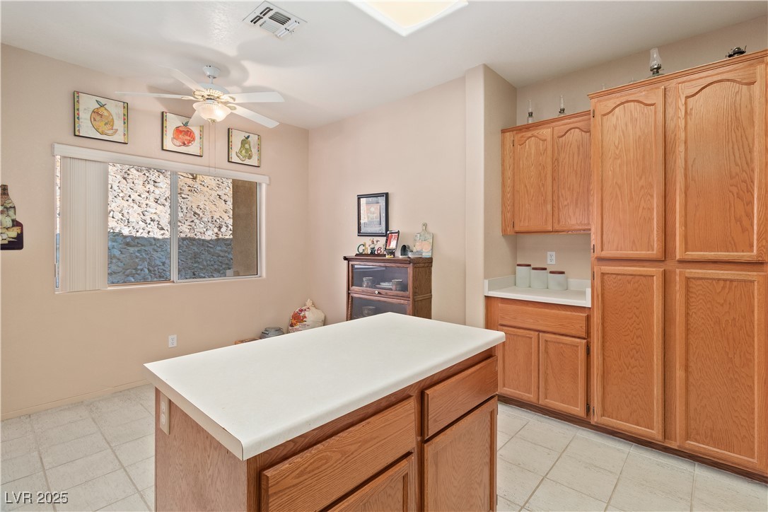 3342 Pheasant Canyon Way, Unit 1013 Laughlin, NV 89029 - Photo 15 of 74 Kitchen featuring a ceiling fan, light countertops