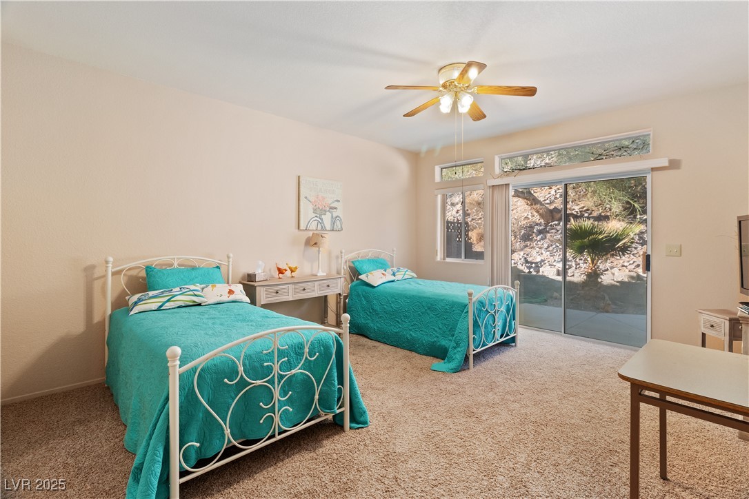3342 Pheasant Canyon Way, Unit 1013 Laughlin, NV 89029 - Photo 22 of 74 Carpeted Primary bedroom with access to exterior a