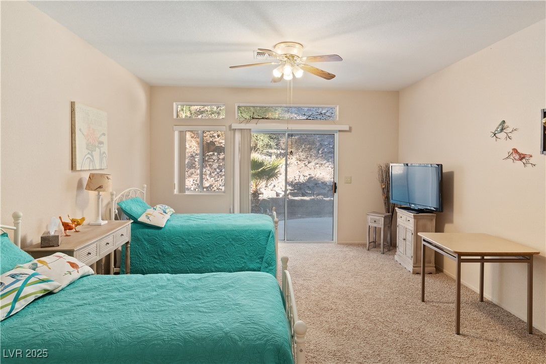 3342 Pheasant Canyon Way, Unit 1013 Laughlin, NV 89029 - Photo 25 of 74 Primary Bedroom with access to exterior, carpet fl