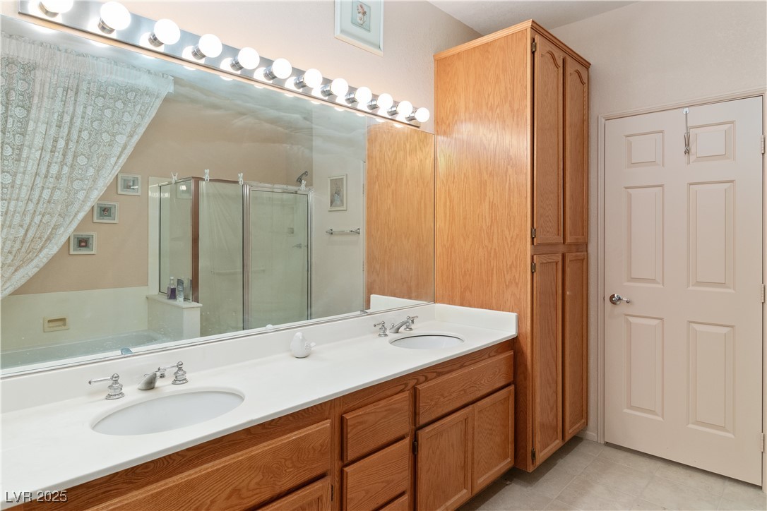3342 Pheasant Canyon Way, Unit 1013 Laughlin, NV 89029 - Photo 27 of 74 Bathroom featuring double vanity, a walk-in shower
