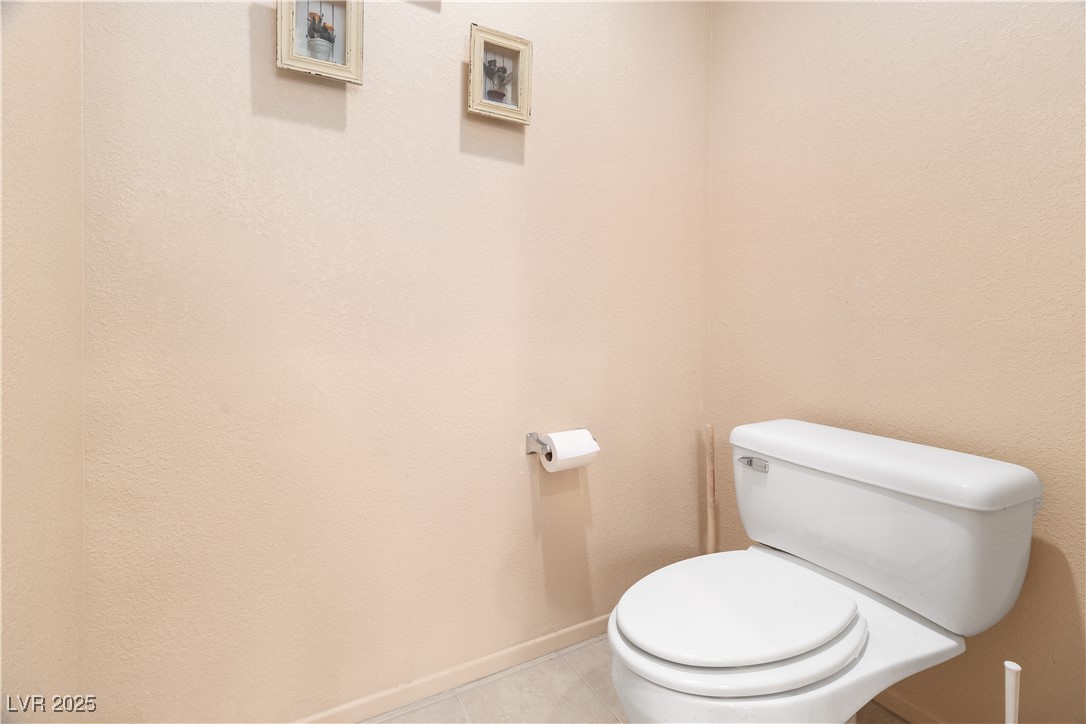 3342 Pheasant Canyon Way, Unit 1013 Laughlin, NV 89029 - Photo 30 of 74 Bathroom water closet with baseboards, toilet, and