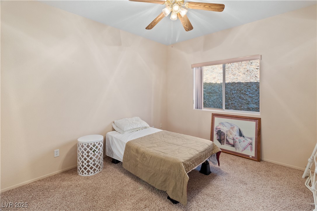 3342 Pheasant Canyon Way, Unit 1013 Laughlin, NV 89029 - Photo 31 of 74 Second Bedroom with a ceiling fan, light carpet, a