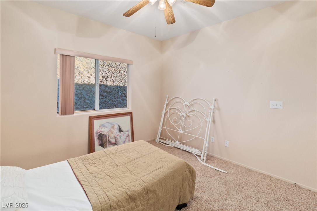 3342 Pheasant Canyon Way, Unit 1013 Laughlin, NV 89029 - Photo 32 of 74 Second Bedroom with a ceiling fan, carpet, and bas