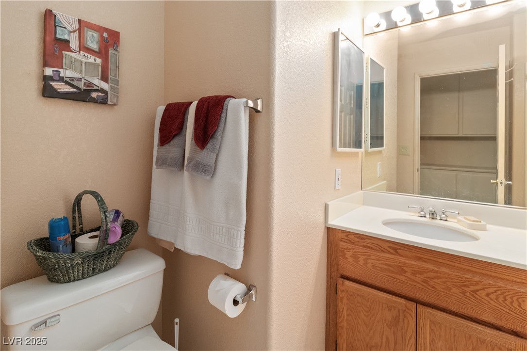 3342 Pheasant Canyon Way, Unit 1013 Laughlin, NV 89029 - Photo 34 of 74 Hallway full Bathroom featuring vanity and toilet