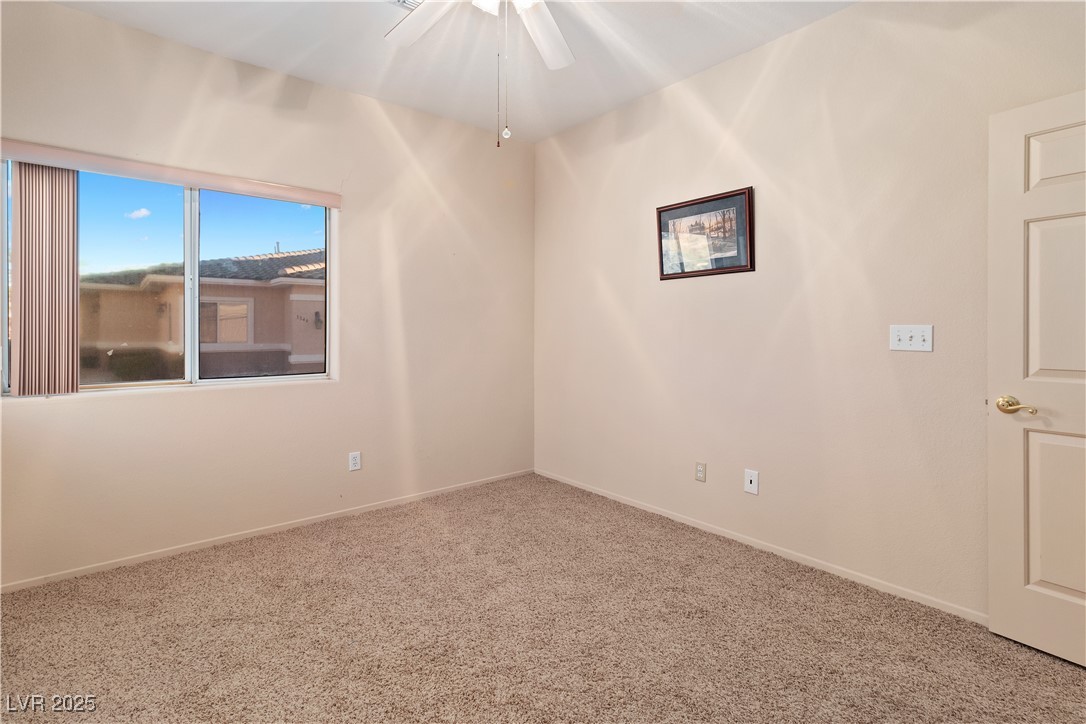 3342 Pheasant Canyon Way, Unit 1013 Laughlin, NV 89029 - Photo 37 of 74 Carpeted third bedroom featuring baseboards and wi