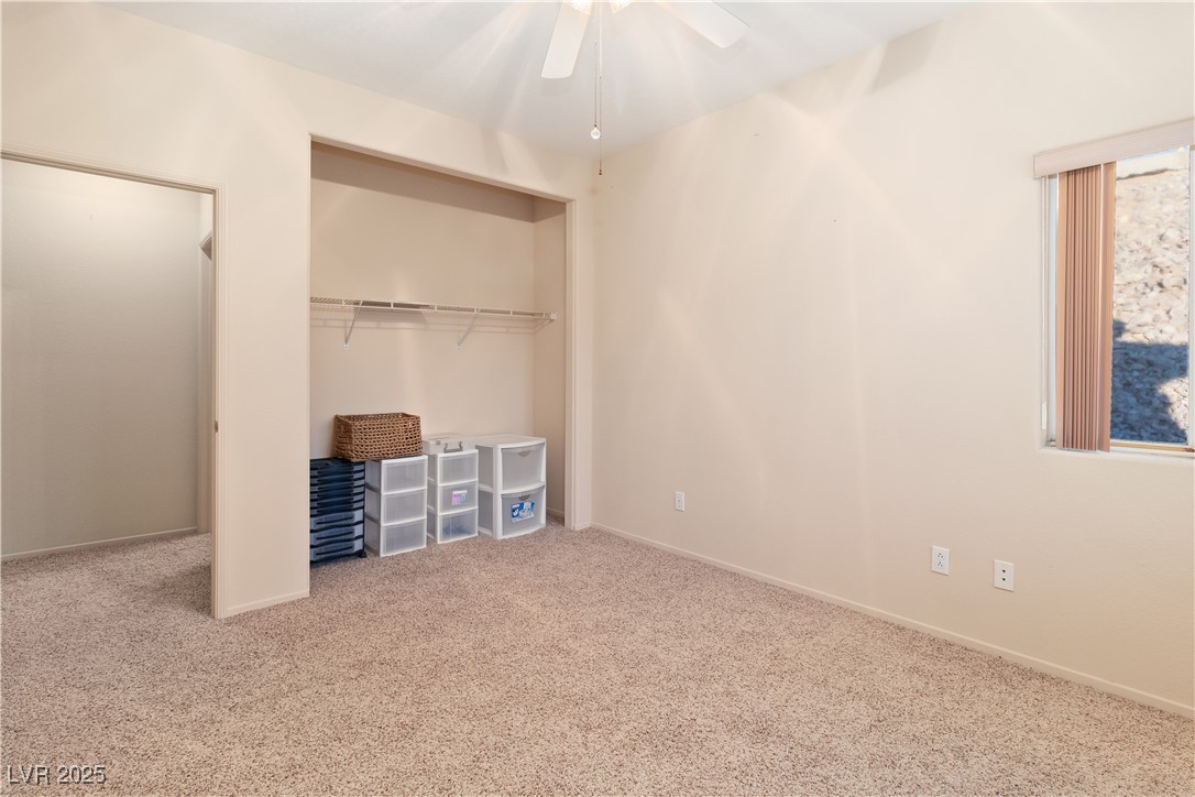 3342 Pheasant Canyon Way, Unit 1013 Laughlin, NV 89029 - Photo 38 of 74 Third bedroom with ceiling fan, a closet, baseboar