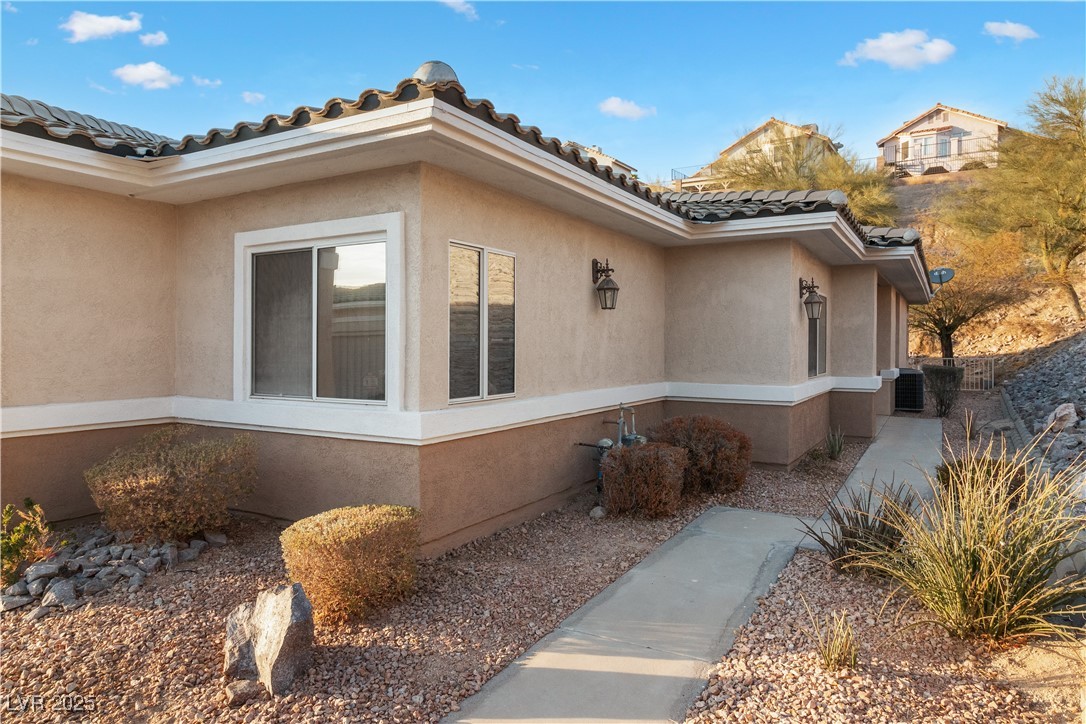 3342 Pheasant Canyon Way, Unit 1013 Laughlin, NV 89029 - Photo 4 of 74 View of side of property with a tiled roof and stu
