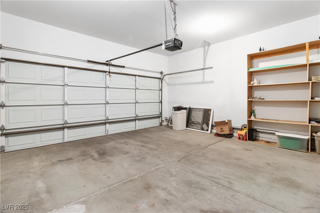 3342 Pheasant Canyon Way, Unit 1013 Laughlin, NV 89029 - Photo 43 of 74 Garage featuring a garage door opener