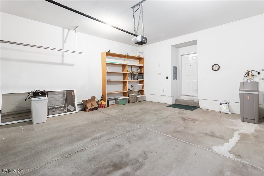 3342 Pheasant Canyon Way, Unit 1013 Laughlin, NV 89029 - Photo 44 of 74 Garage with and a garage door opener