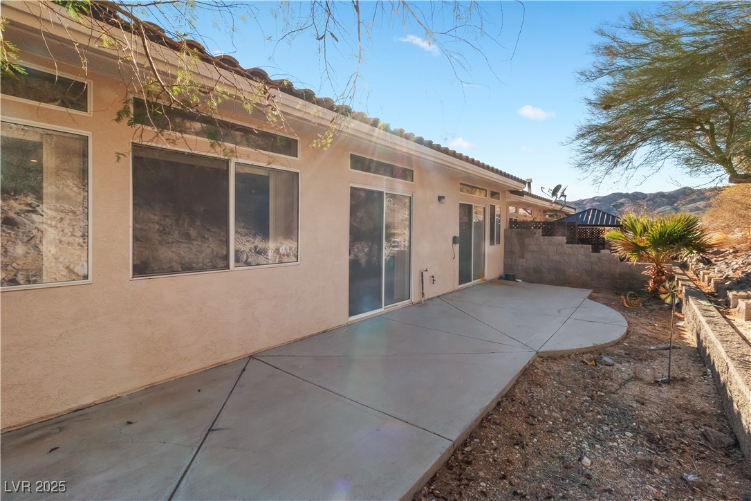 3342 Pheasant Canyon Way, Unit 1013 Laughlin, NV 89029 - Photo 48 of 74 Rear view of property featuring a patio and stucco